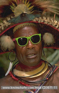 PAPUA NEW GUINEA: Huli tribesmen in decorative dress and sunglasse, near Tari Highlands.