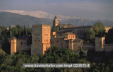 SPAIN, GRANADA: Alhambra Moorish Palace at dusk, Sierra Nevada in background.