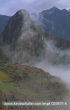 PERU, MACHU PICCHU: Peru, Andes, Inca ruins on a misty morning above Urubamba Valley.