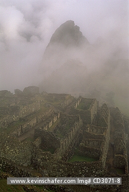 PERU, MACHU PICCHU: Peru, Andes, Machu Picchu, Inca ruins,  mist rises from Urubamba Valley.