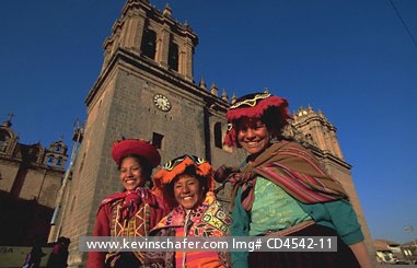 PERU, CUZCO: Plaza de Armas, a few Quechua girls in decorative traditional dress.