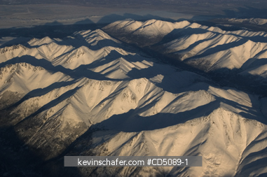 ALASKA: Chugach Range, aerial of foothills near Eagle River   WINTER.