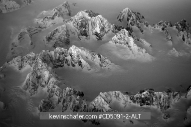 GREENLAND: Winter aerial of mountain range in Greenland, black and white, digital file, small usages only.