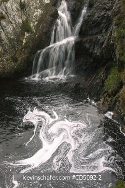 SCOTLAND, SHETLAND ISLANDS: Shetland, Mainland, Burn of Lunklet stream. Foam beneath small waterfall. Winter