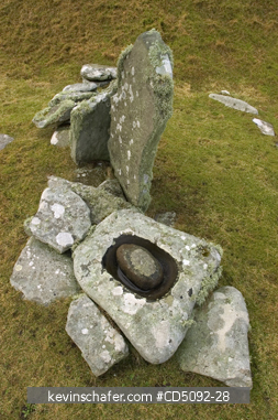 SCOTLAND, SHETLAND ISLANDS: Jarshof Ruins, Stone mortar & pestle and other stones from excavated Iron Age Settlement