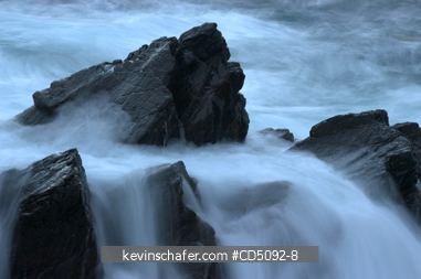 SCOTLAND, SHETLAND ISLANDS: Waves break on rocky shore, dusk, Sumburgh Head, South mainland, Shetland