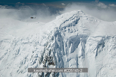 ANTARCTICA, SOUTH GEORGIA: Royal Navy Helicopter over Mt. Paget, highest peak on South Georgia, December 2005