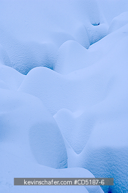 WASHINGTON, US: Snoqualmie Pass, heavy snow along forest creek, CASCADE MOUNTAINS, Washington, USA  
