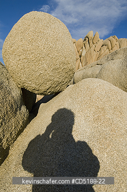 CALIFORNIA, US: Persons shadow on boulders in Joshua Tree National Park, CA, USA