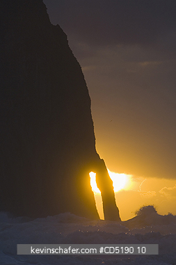 OREGON, USA: Haystack Rock and arch at sunset, Cape Kiwanda, Oregon Coast, Pacific Ocean