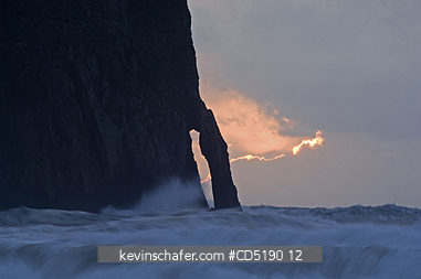 OREGON, USA: Haystack Rock and arch at sunset, Cape Kiwanda, Oregon Coast