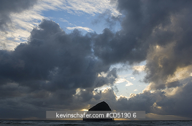 OREGON, USA: Haystack Rock and arch at sunset, Cape Kiwanda, Oregon Coast