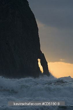 OREGON, USA: Haystack Rock and arch at sunset, Cape Kiwanda, Oregon Coast, Pacific Ocean
