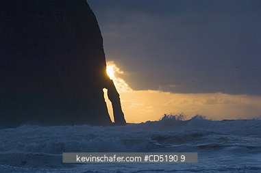 OREGON, USA: Haystack Rock and arch at sunset, Cape Kiwanda, Oregon Coast, Pacific Ocean