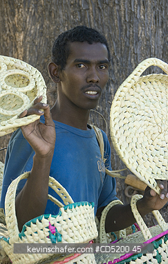 MADAGASCAR: Man selling baskets, Mahajanga, Western Madagascar