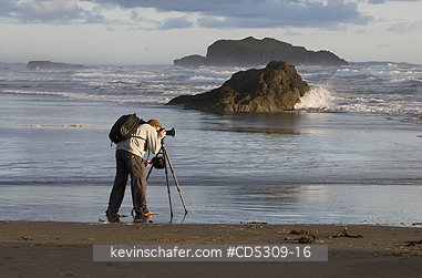 OREGON, BANDON: Photographer waiting for sunset, Bandon, Oregon Coast, USA