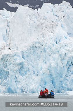 NORWAY, SVALBARD: Zodiac takes travelers along glacier front, Monaco Glacier, Leifdefjord, Svalbard, Norway