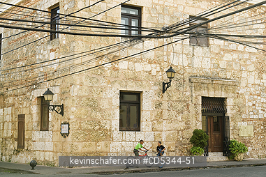 DOMINICAN REPUBLIC, PEOPLE: Dominican Republic, Santo Domingo, Colonial center, boys on bikes in historic district
