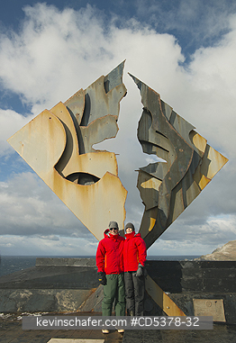 CHILE, PEOPLE: Tourists stand below Cape Horn Monument, Cape Horn, Chile
