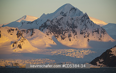 ANTARCTICA, SCENIC: Mountains and Ice at dusk, south of Lemaire Channel, Antarctic Peninsula, Antarctica