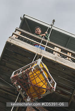 OREGON, PEOPLE: Theo Braibish, aged 12, Hauling up food, Five Mile Butte Lookout tower, Mt. Hood National Forest, Oregon