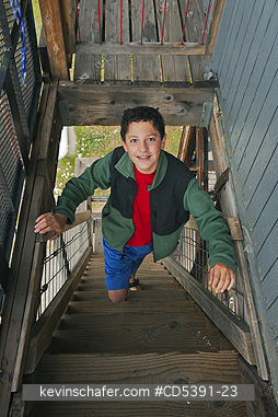 OREGON, PEOPLE: Theo Braibish, aged 12, Climbing Fivemile Butte lookout tower, Mt. Hood National Forest, Oregon MR