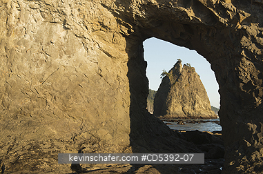 WASHINGTON, COAST: View of Sea Stack through Hole-in-the-Wall natural arch, Rialto Beach, Olympic National Park, Washington