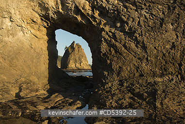 WASHINGTON, COAST: View of Sea Stack through Hole-in-the-Wall natural arch, Rialto Beach, Olympic National Park, Washington