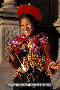 PERU: Cuzco, Quechua girl in colorful attire, Plaza de Armas.