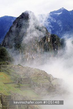 PERU: Machu Picchu, Inca Ruins, misty morning above Urubamba Valley.