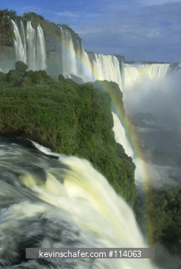 BRAZIL, PARANA STATE: Iguacu National Park, rainbows form in spray from great falls.