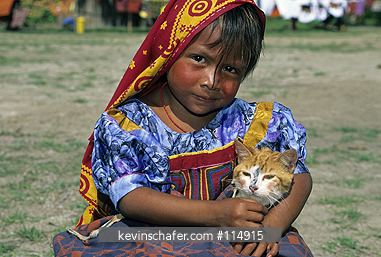 PANAMA, PEOPLE: Young girl with cat, San Blas Islands, home of Kuna Indians.