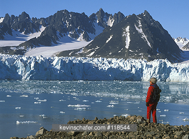 NORWAY, SPITSBERGEN: Liefdefjord, Monaco Glacier, tourist on high arctic archipelago.