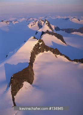 ALASKA, USA: Southeast, Juneau icefield above Juneau, sunset over Taku Towers, (nunataks)