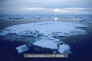 ALASKA: Midnight sun on pack ice, June, Bering Sea.