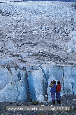 ALASKA: USA, Alaska, Glacier Bay National Park, Hikers in front of Alsek Glacier.