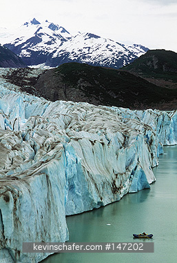 USA, ALASKA, PEOPLE: Rafters on Alsek Lake, approaching edge of glacier, Glacier Bay National Park.