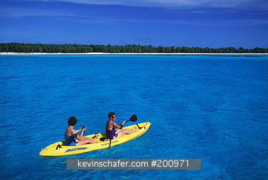 Midway Atoll, NW Hawaiian Is.: Two women kayakking on atoll lagoon, Midway Atoll,  Model Released