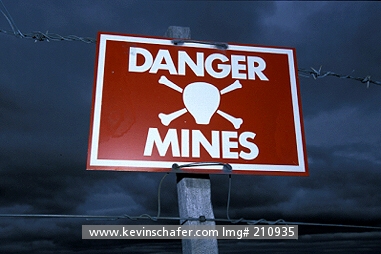 FALKLAND ISLANDS: Falkland Islands, Warning signs along major road, Legacy of 1982 war with Argentina.