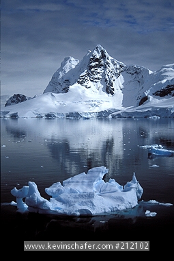 ANTARCTICA: Antarctica Peninsula, Paradise Bay area, iceberg and mountains, December.