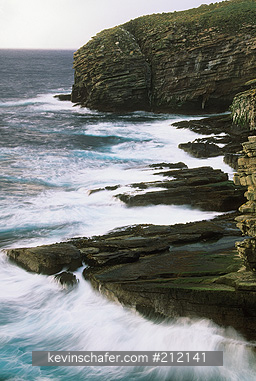 FALKLAND ISLANDS: Falkland Islands, New Island, Cliffs facing western swells in December.