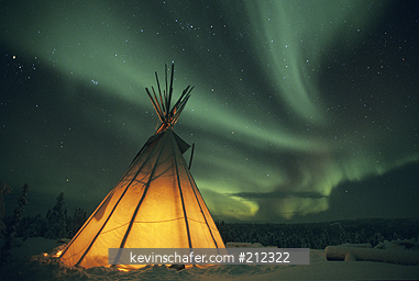CANADA: Blachford Lake, Great Slave Lake area, near Yellowknife, teepee at night with Aurora Borealis, northern lights, Northwest Territories.