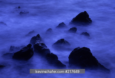ASCENSION ISLAND: Ocean and lava rocks at sunrise, slow-motion, South Atlantic Ocean.
