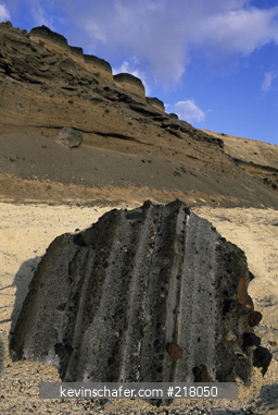ASCENSION ISLAND: Hannay Beach, northeast coast, volcanic ash layers visible in boulder on beach.