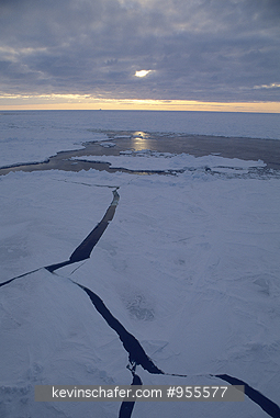 ANTARCTICA: Antarctica, Midnight sun, fissures in pack ice.