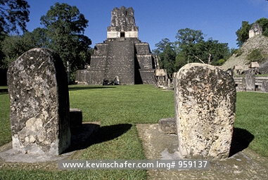 GUATEMALA: Tikal National Park, Peten area, Great Plaza, Maya ruins, Temple II in background, Stelae in foreground, a UN World Heritage site.
