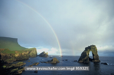 SCOTLAND: United Kingdom, Scotland, Shetland Islands, Isle of Foula, Rainbow over the sea.
