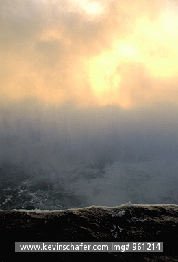 USA, NEW YORK: Niagara Falls, Horseshoe Falls rising into mist at sunrise (from Canadian side).