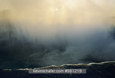 USA, NEW YORK: Niagara Falls, Horseshoe Falls rising into mist at sunrise, (from Canadian side).