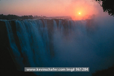 AFRICA, ZIMBABWE: Sunrise and mist over Victoria Falls